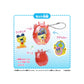 Tamagotchi Product packaging with a figurine, case, and stickers on a blue background