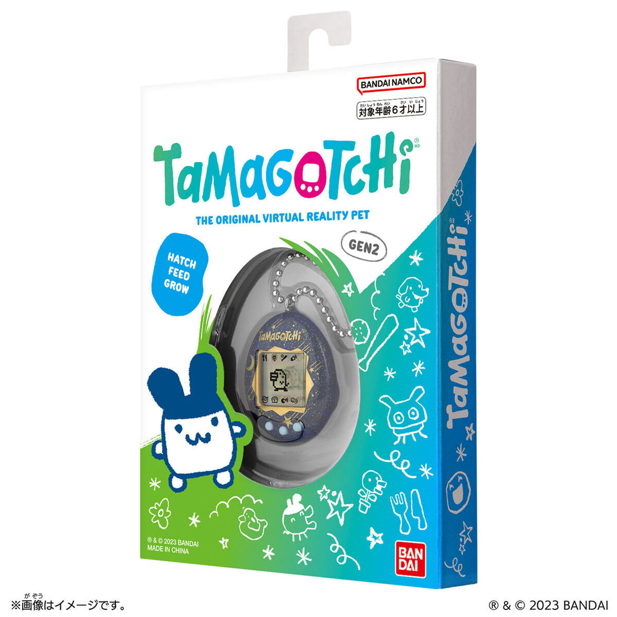 Tamagotchi Gen 2 Virtual Reality Pet toy in its original retail packaging, featuring a white and blue box with green accents and a clear window showing the toy inside.